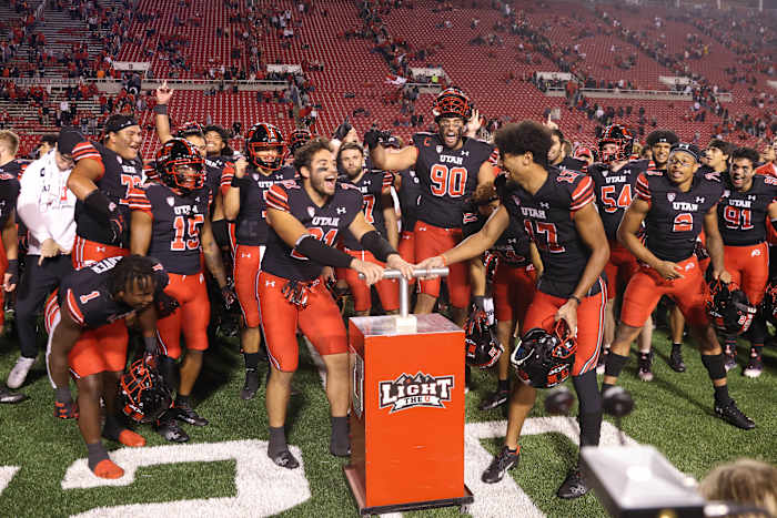 Utah Utes linebacker Karene Reid (21) and Utah Utes wide receiver Devaughn Vele (17) light the block U after a victory against the San Diego State Aztecs at Rice-Eccles Stadium.